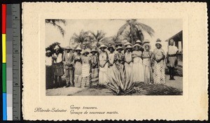 Young women in patterned dresses assembling outdoors, Congo, ca.1920-1940