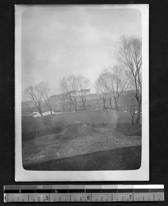 Huts of famine victims living near graves, Sichuan, China, 1912