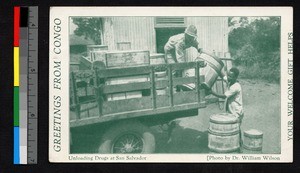 Men unloading barrels from the back of a truck, Angola, ca.1935