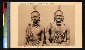 Two young men wearing feather headdresses, Kenya, ca.1927