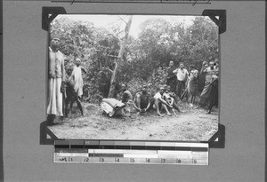 African porters taking a break, Tukuyu, Tanzania, 1929