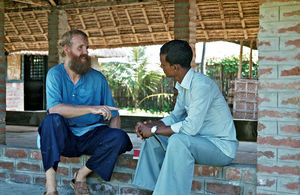 Missionary and Teacher, Filip Engsig-Karup talking with a local employee. Sent by the Danish Sa