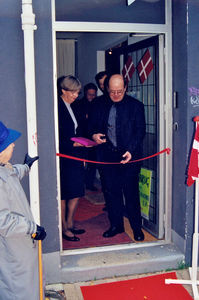 Cutting of the ribbon at opening of a new second hand shop, December 1999