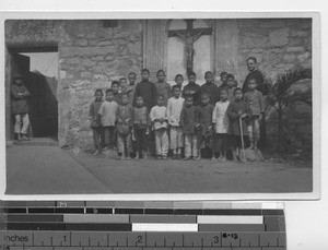 Maryknoll Father with students at Hong Kong, China, 1922