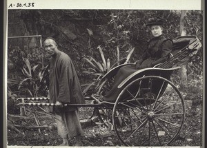 Missionary's wife in a two-wheel carriage