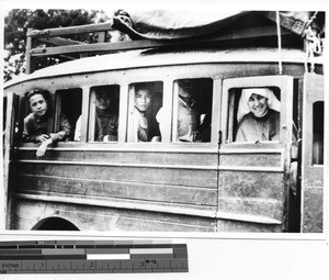 Sister Rita M. Regan on a bus in Meixien, China