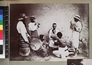 Group of musicians playing traditional instruments at ceremony, probably circumcision, Madagascar, ca. 1913