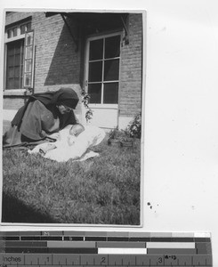 An abandoned child with a Maryknoll Sister at Fushun, China, 1932