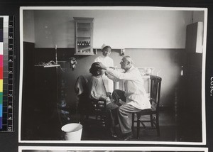 Doctor examining patient in hospital, Wuhan, China, ca. 1937