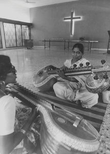 Arcot Lutheran Church/ALC, South India. Two girls practise playing the zither at the chapel of