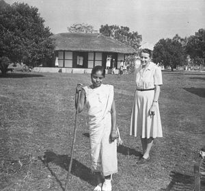 Santipara Leprosy Centre, Assam, North India, founded in 1939. Missionary/Nurse with a leper pa