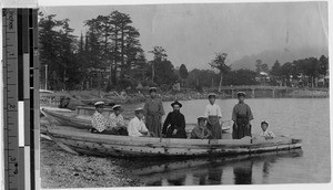 Fr. Lebarbey and his pupils sitting in a boat, Yokohama, Japan, October 1921