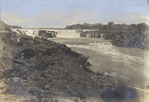 Distant view of the Ngonga falls from the west side, in Northern Rhodesia, Zambia