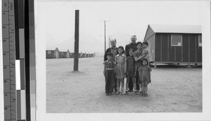 Family with Fr. Hugh Lavery, MM at the Japanese Relocation Camp, Manzanar, California, ca. 1944
