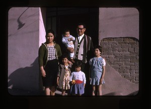 Family outside their home