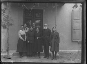 Group of people standing in front of the entrance to a building