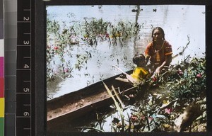 Warrou woman and child in canoe, Guyana, ca. 1934