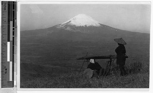 Two men in a grassy field near Mt. Fuji, Japan, ca. 1920-1940