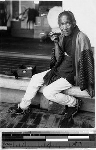 Portrait of a Japanese man smoking, Japan, August 1932