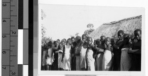 Group of girls standing in front of a school, Africa, March 1947