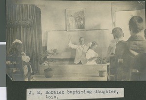 McCaleb Baptizes His Oldest Daughter, Lois, ca.1900-1910