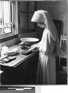 Nursing student sterilizes equipment, Toishan, China, ca. 1947