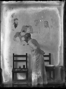 Fr. Vincent Lebbe painting a religous scene on a wall, China, ca. 1906-1919