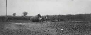 A wagon, that is stuck in the mud on the road between Sweihwafu and Harbin