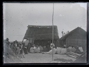 Anders Johannessen Rustad and Malagasy gathered outside his houses, Madagascar, ca.1893