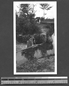 Fixing a dam, Sichuan, China, ca.1929