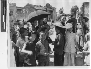 Curious people at Xinhui, China, 1947