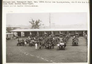 Kumase, Millers Ltd., Transport Dept. Dec. 1916. Behind the main building, opposite the Basel Mission Trading Company. Fords in front, Benz cars behind. At the rear on the left the Basel mission house