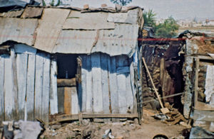 Mission at the bottom - City Mission in Madagascar. The houses in the slums are built of fragil