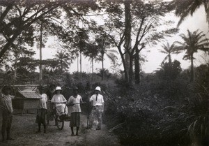 On their way to visit a church, in Cameroon