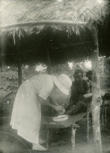 Miss Bruneton with a sick person, in Gabon