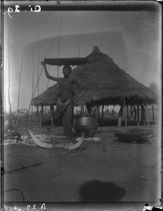 African boy carrying a container on his head