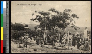 Group posing near a water source, Togo, ca. 1920-1940
