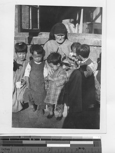 Maryknoll Sister with orphans at Fushun, China, 1934