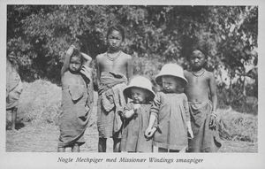 Post card with printed text: "Some Mech girls with Missionary Winding's little girls" (Christin