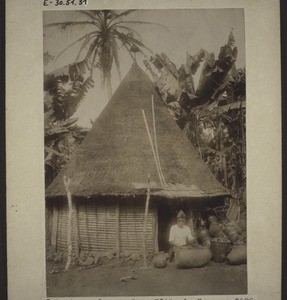 Drum of death in front of a hut in Nyasoso