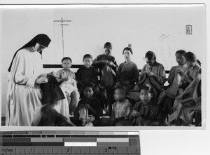 Children doing work at the orphanage at Luoding, China, 1934