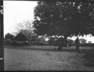 Swiss missionary in a village, Mozambique, ca. 1901-1907