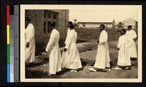 Indigenous clergy walking outdoors, Congo, ca.1920-1940