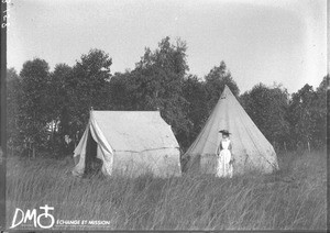 Woman in front of tents, South Africa, ca. 1906-1911