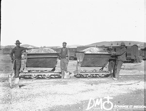 African men standing next to minecarts, Pretoria, South Africa, ca. 1896-1911