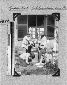 Four boys pounding corn, Genadendal, South Africa