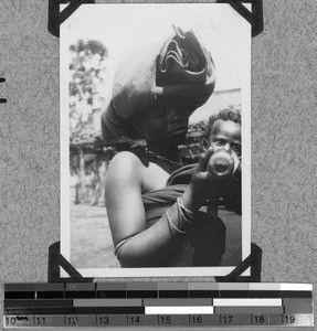 Tembu woman is feeding her child, Baziya, South Africa East