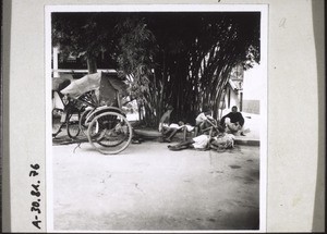 Rickshaw coolies resting in the hospital courtyard in Moiyen