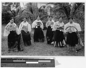 Six Filipinas in traditional dress carrying painted fans, Philippines, ca. 1920-1940