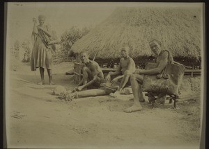 A Bamum smith in front of his smithy